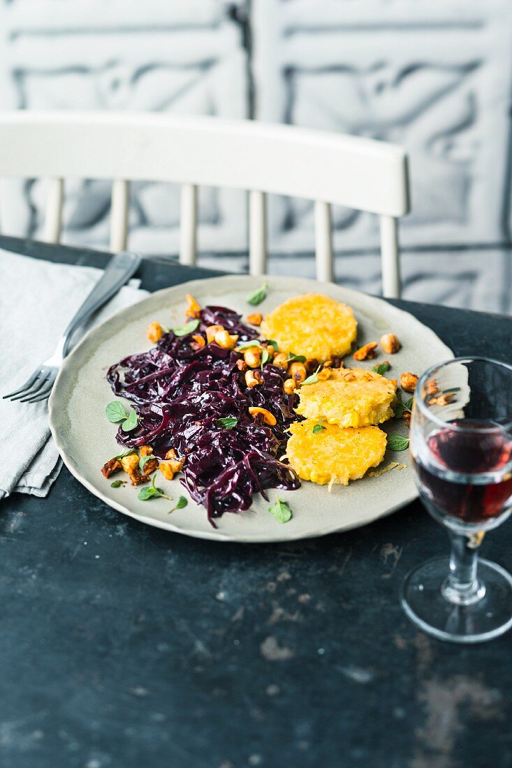 Polenta cakes with elderberry and red cabbage salad and Thai curry paste