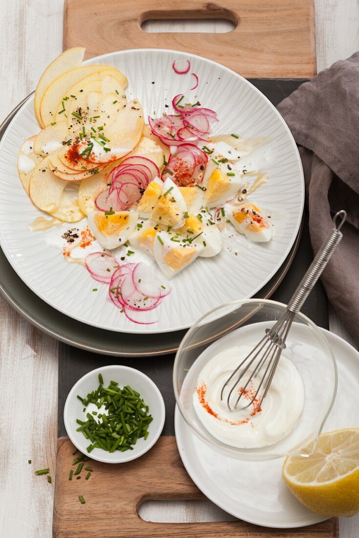 Colourful egg salad with radishes and apple