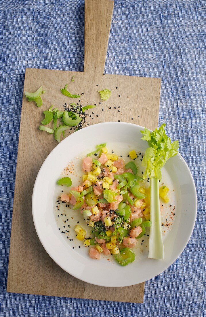 Trout ceviche with mango and sesame seeds