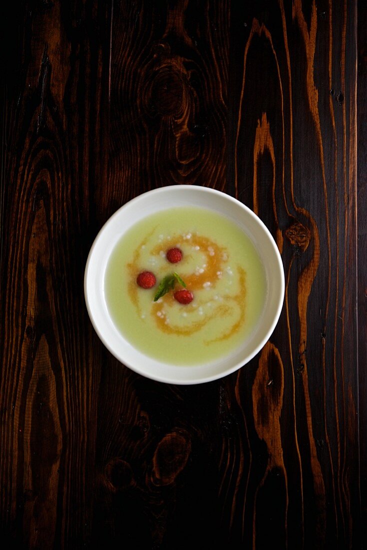 Cold melon soup with raspberries and tapioca pearls
