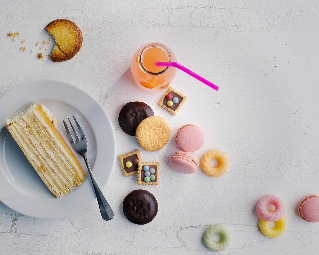 Biscuits, a slice of cake and pink lemonade