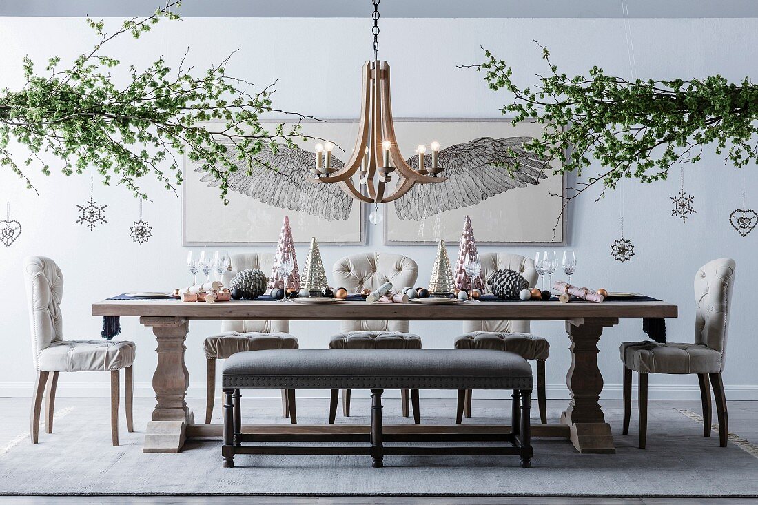 Christmas decorated table with shiny decorative trees and Christmas balls