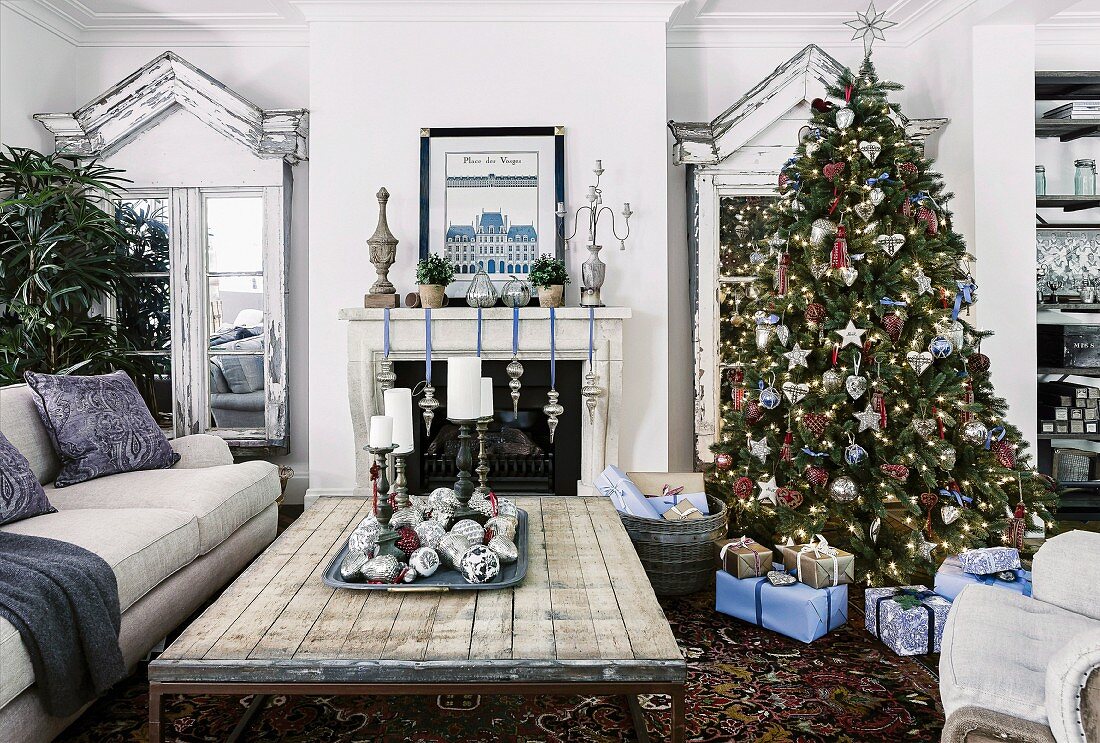 Decorated Christmas tree and wrapped presents in rural living room