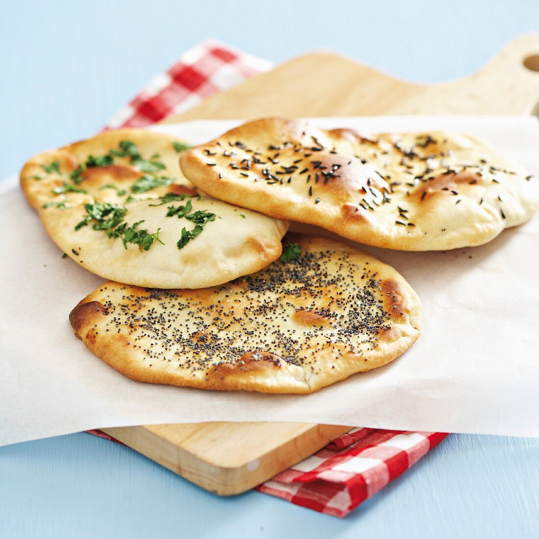 Naan bread with black caraway seeds, coriander and poppy seeds