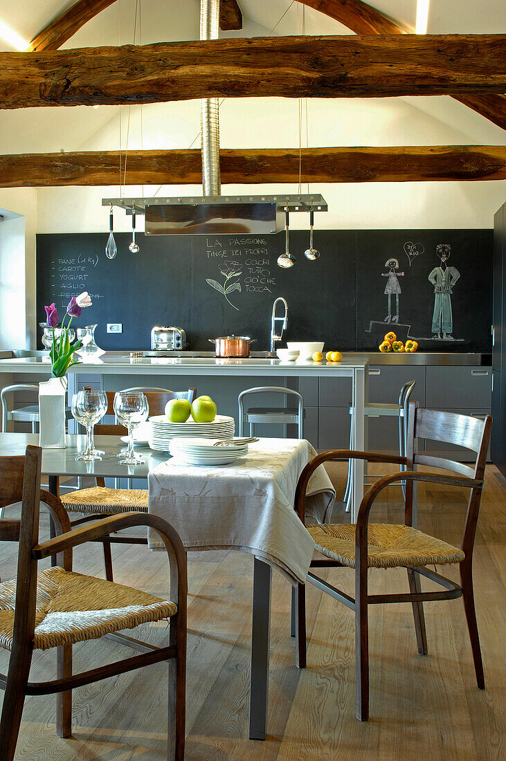 Dining area, in the background kitchen with a chalkboard wall