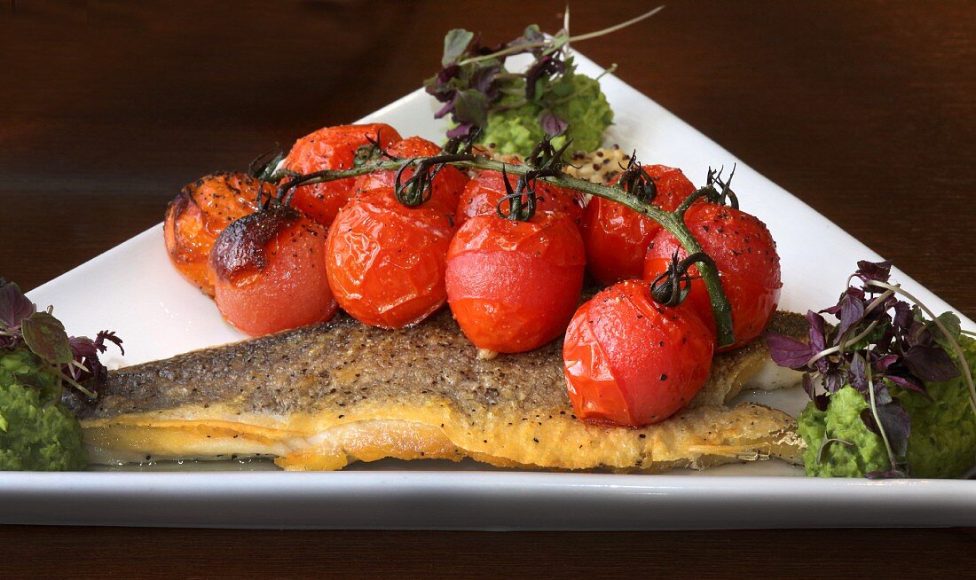 Fried seabass with roasted vine tomatoes