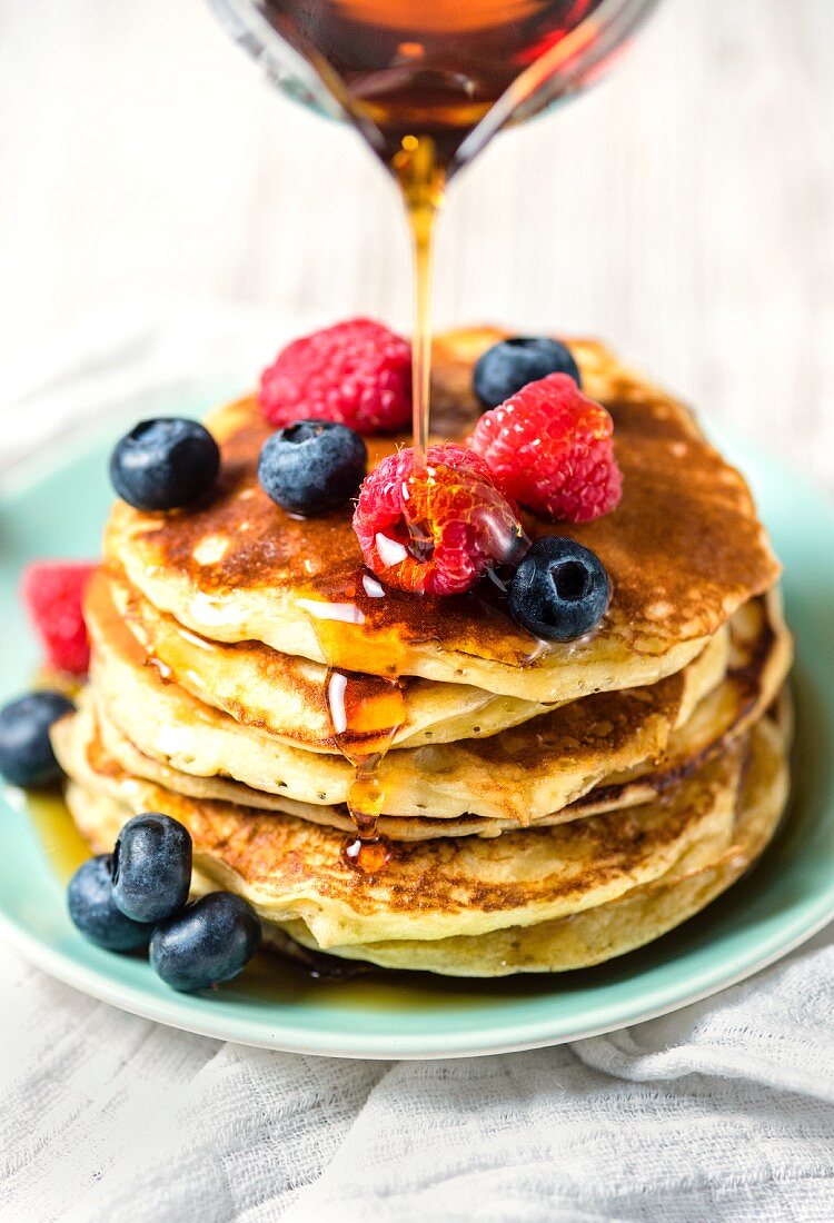 American-style pancakes with fresh berries and maple syrup