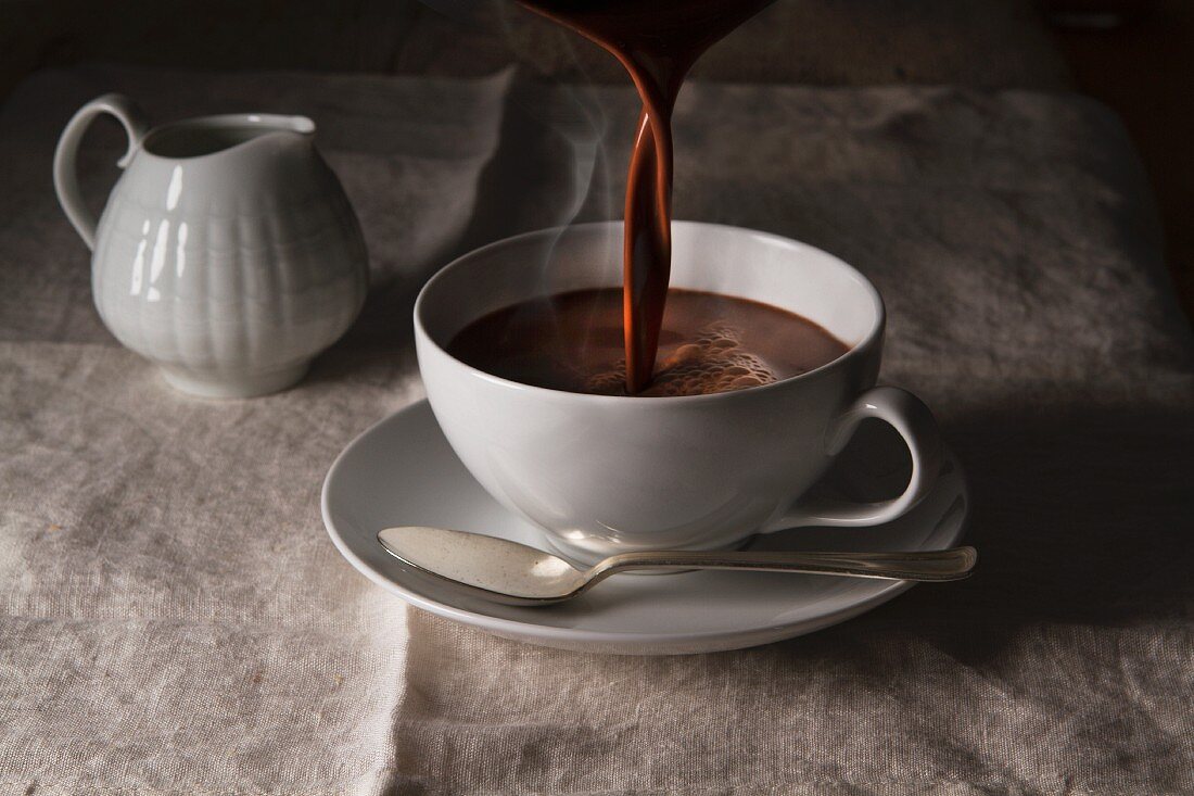 Hot chocolate being poured into a cup