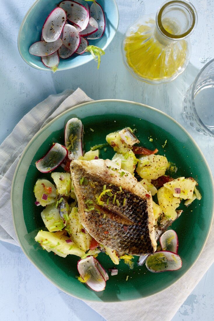 Branzini fillet on a potato and radish salad