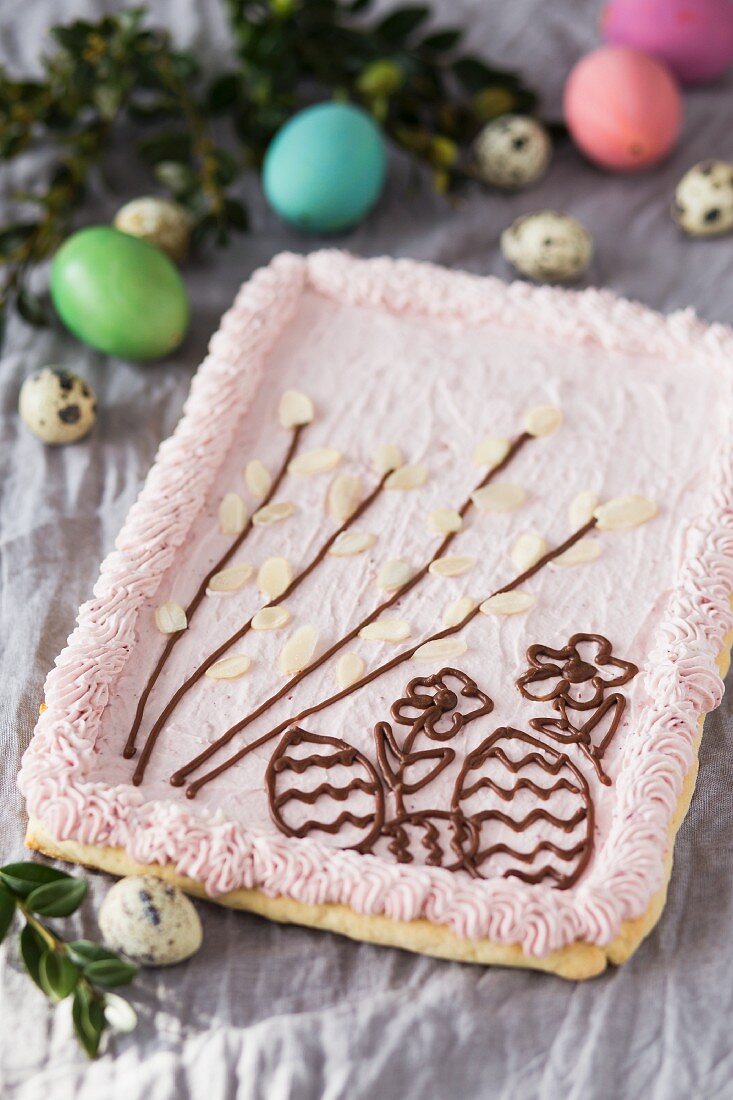 Mazurek (Polish Easter cake) with pink frosting and chocolate patterns