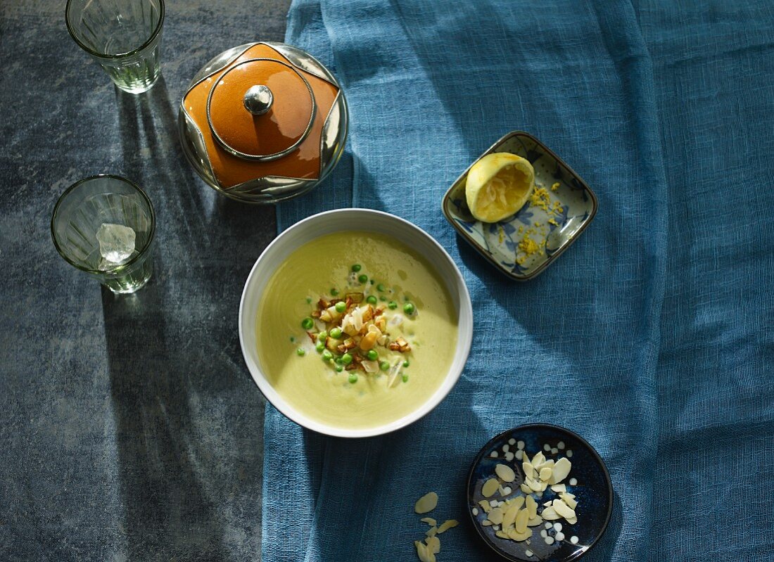 Pea and coconut soup with diced potatoes