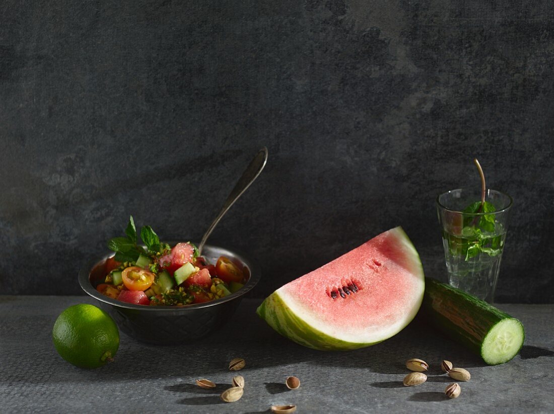 Tomato and melon salad with a mint and pistachio nut dressing