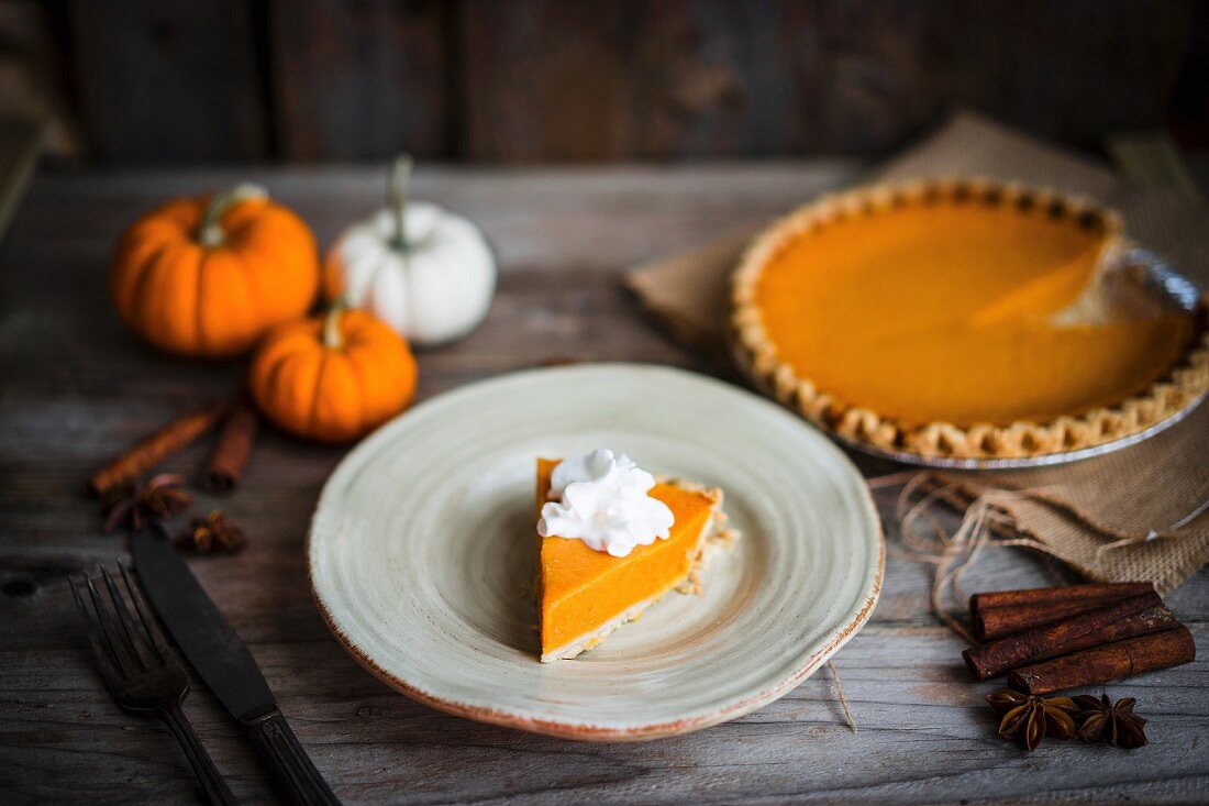 Pumpkin pie on rustic wooden surface