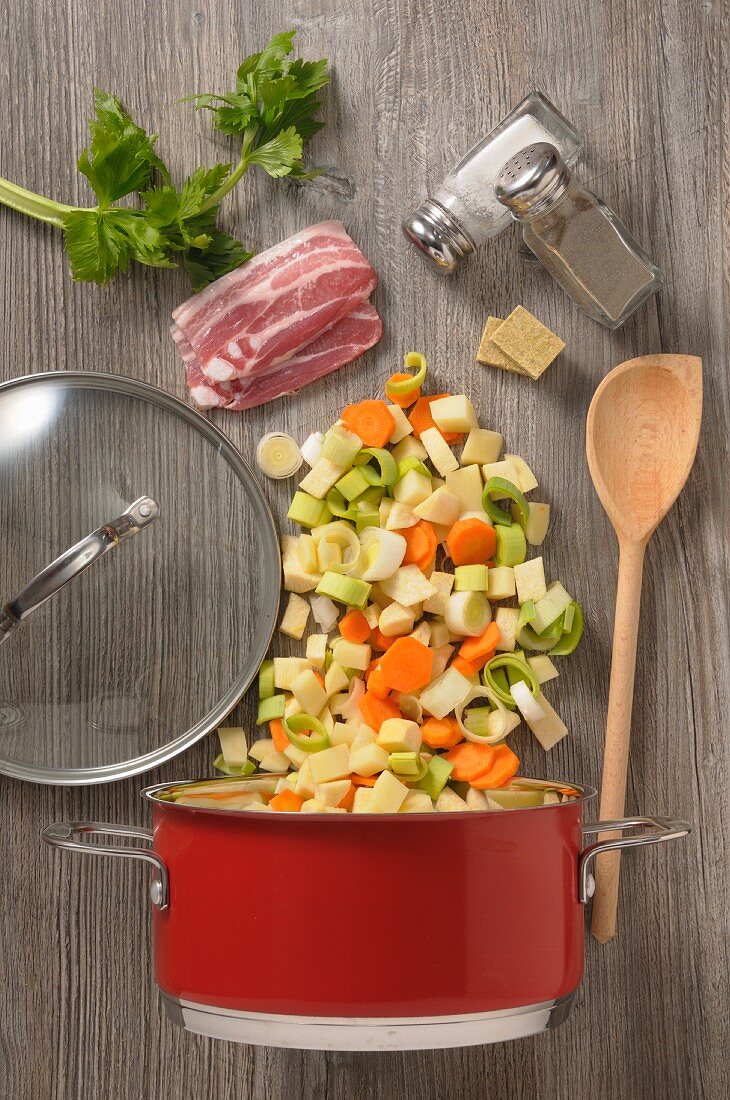 Ingredients of vegetable soup with bacon (seen from above)