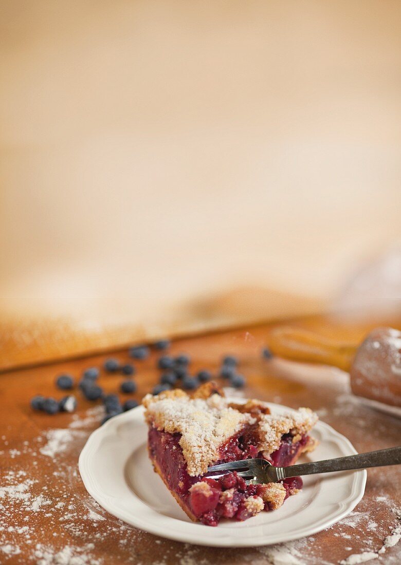 A slice of berry cake with apple