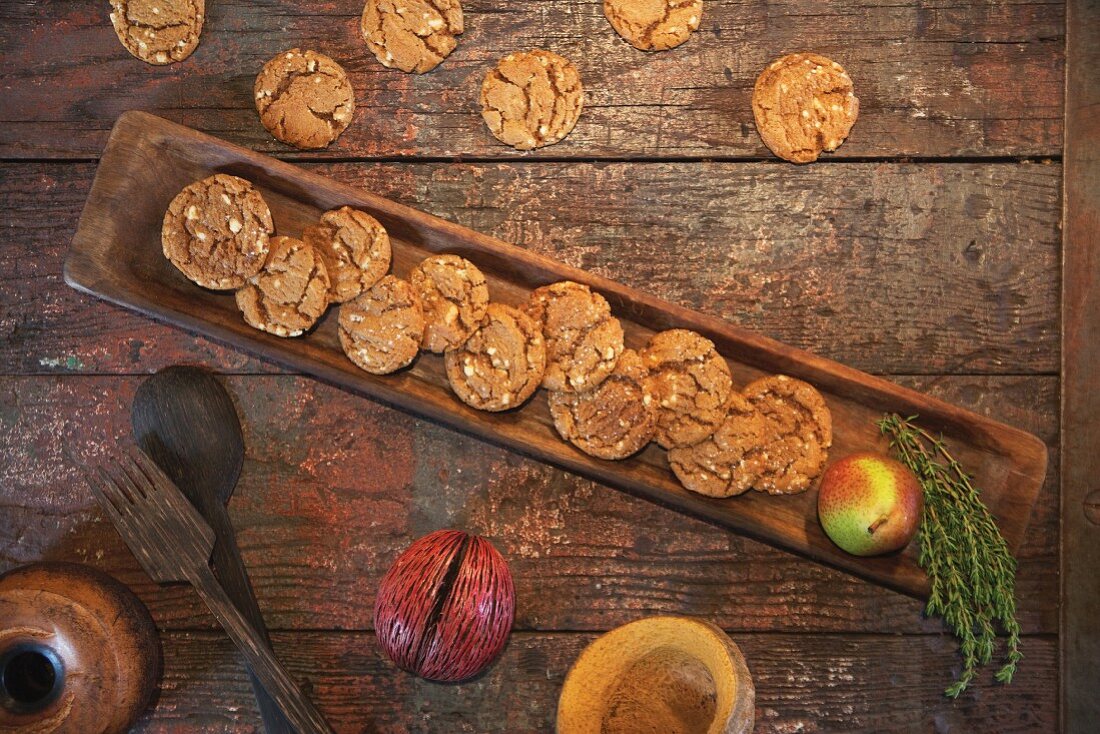 Ginger snap biscuits on a rustic wooden table