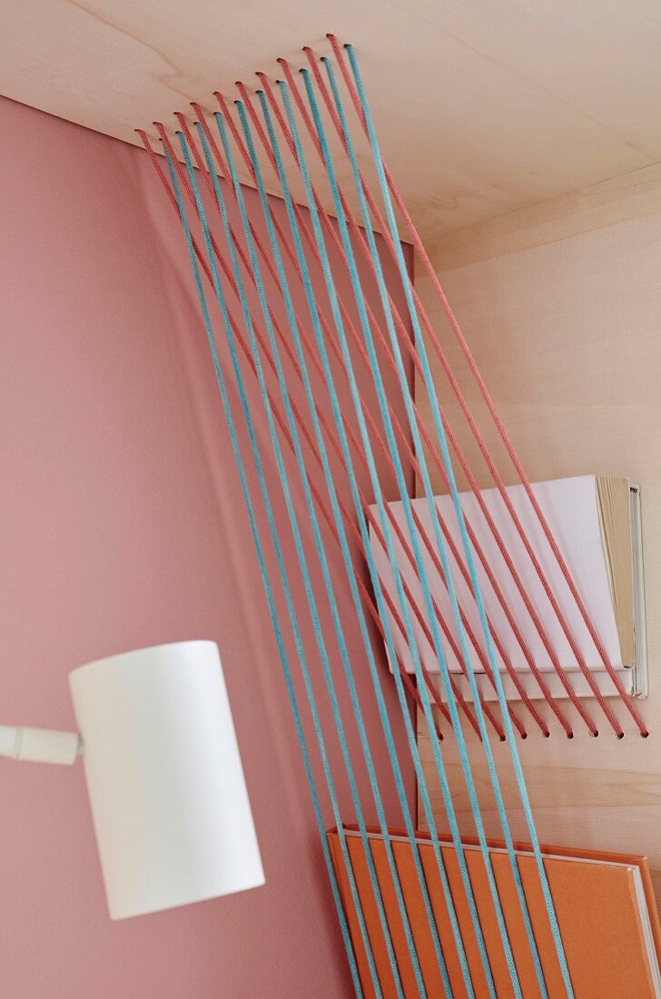 Storage space created in a shelf used taut rope