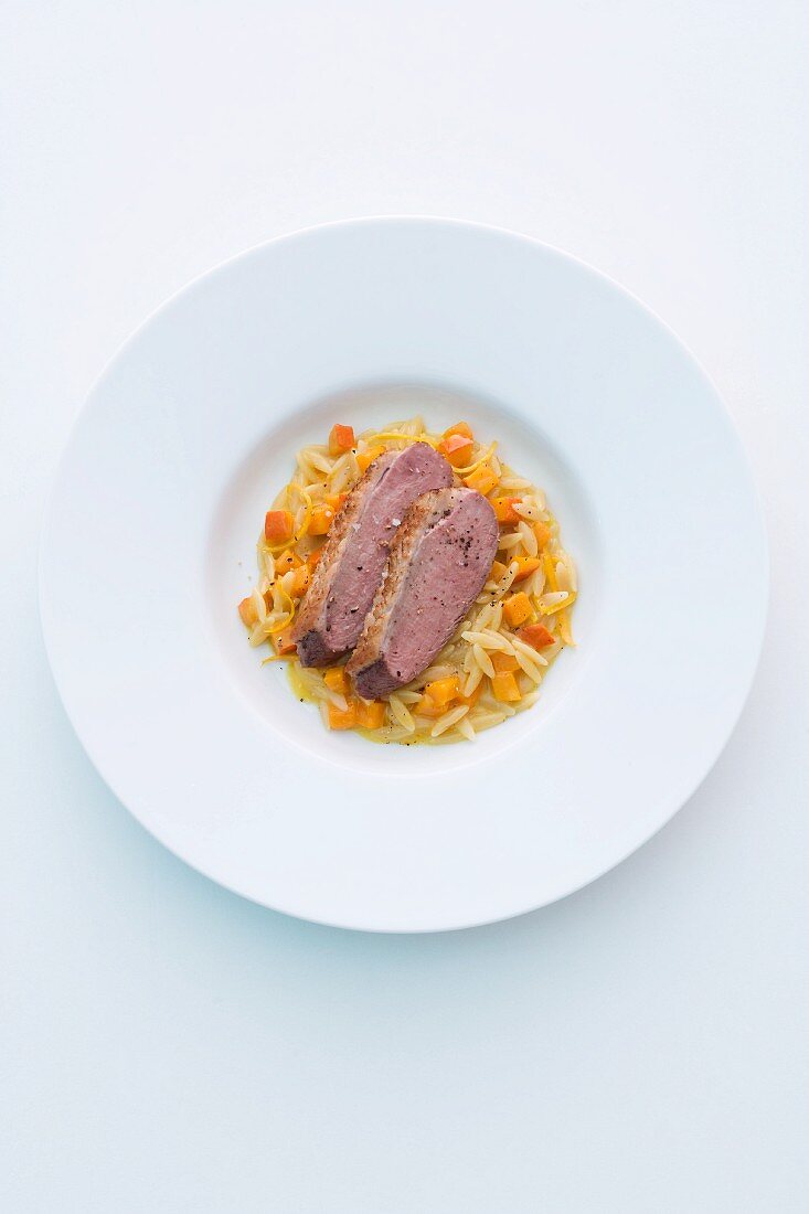 Duck breast with Greek rice noodles and pumpkin