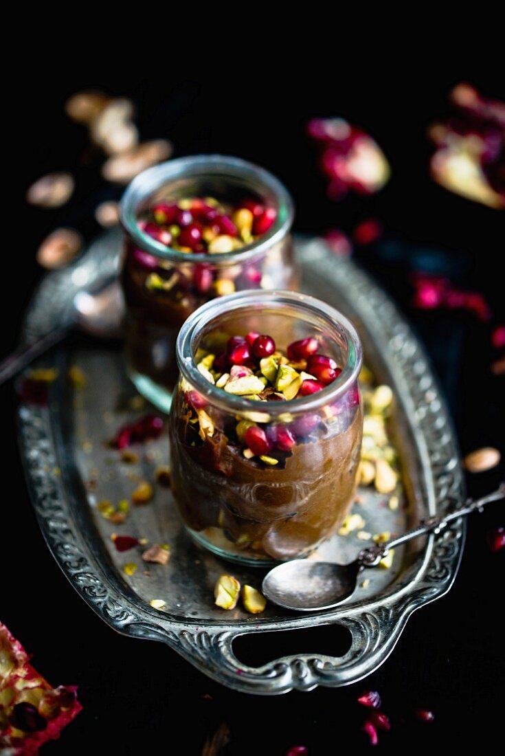 Chocolate and avocado cream with pistachio nuts and pomegranate seeds