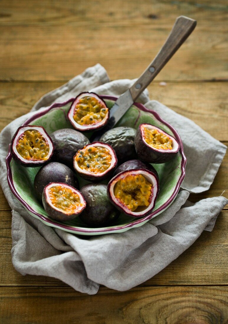 Red passion fruits in a bowl