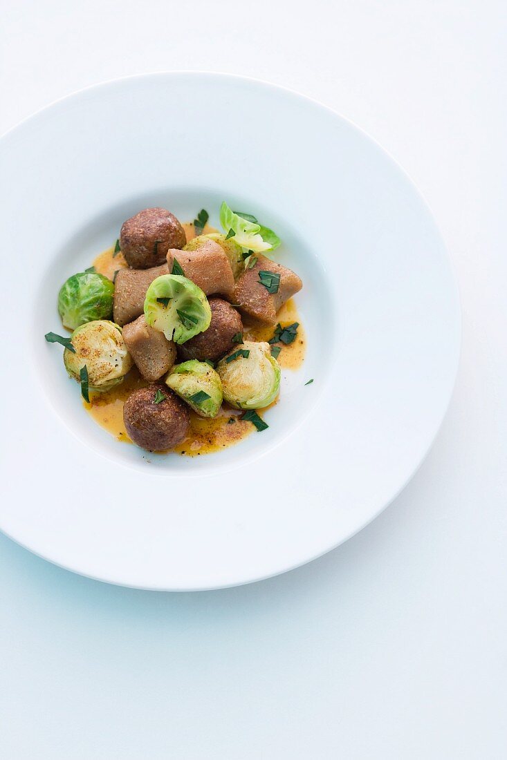 Wild boar meatballs with chestnut gnocchi and Brussels sprouts