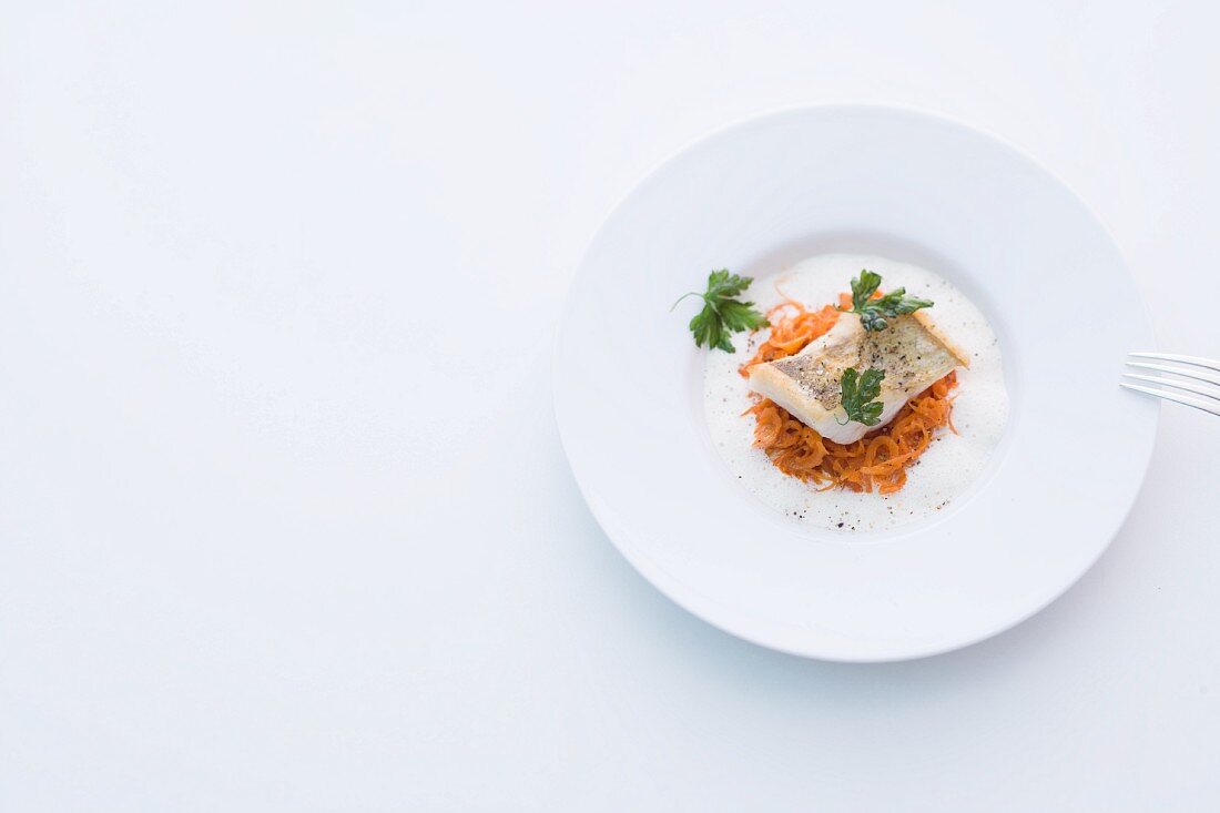 Zander fillet on pepper-infused cabbage in Riesling sauce