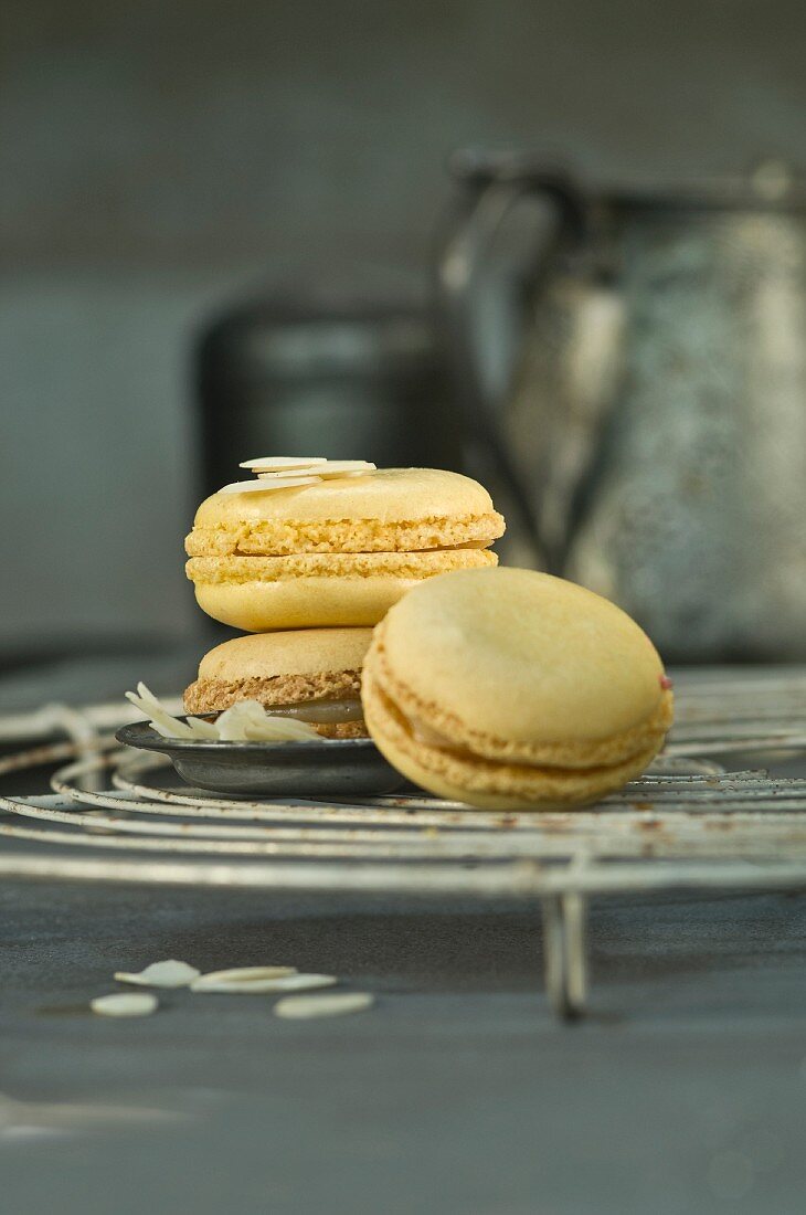 Lemon macaroons with flaked almonds on a wire rack