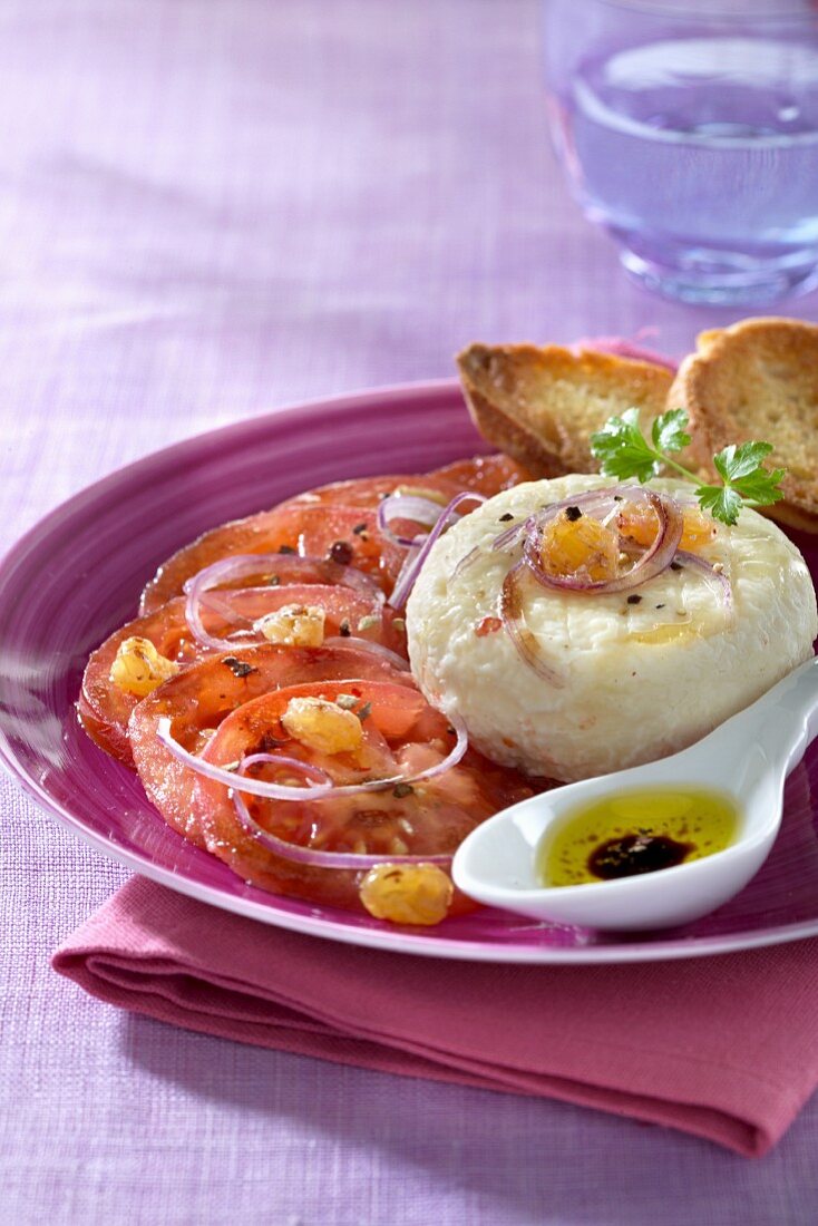 An appetiser of goat's cheese and tomatoes