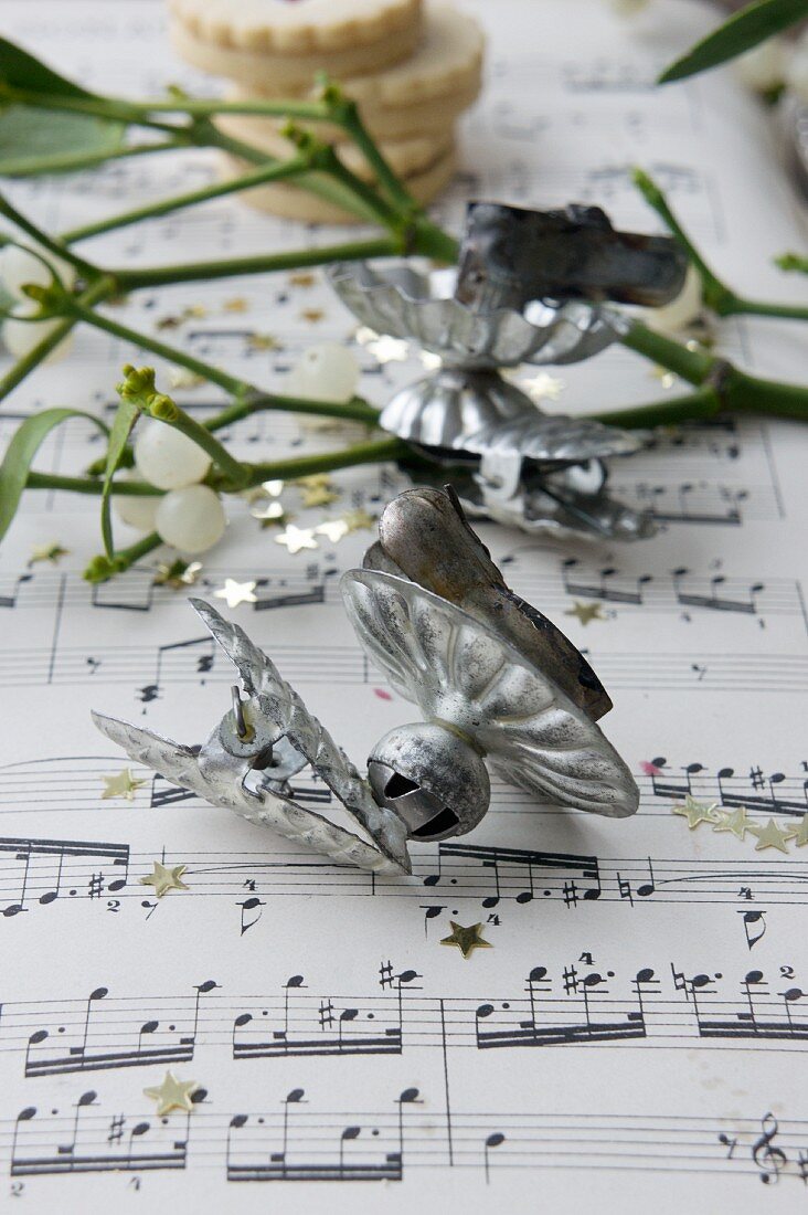 Vintage candle clips on sheet music