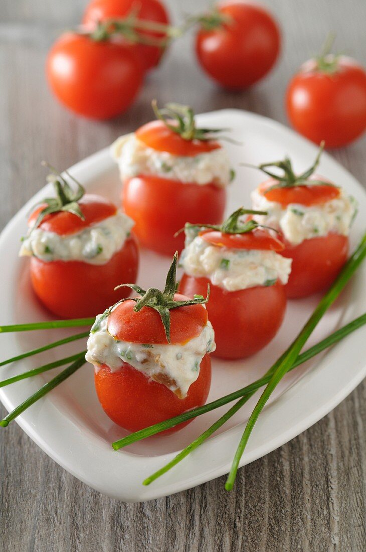 Cocktail tomatoes filled with goat's cream cheese and anchovies