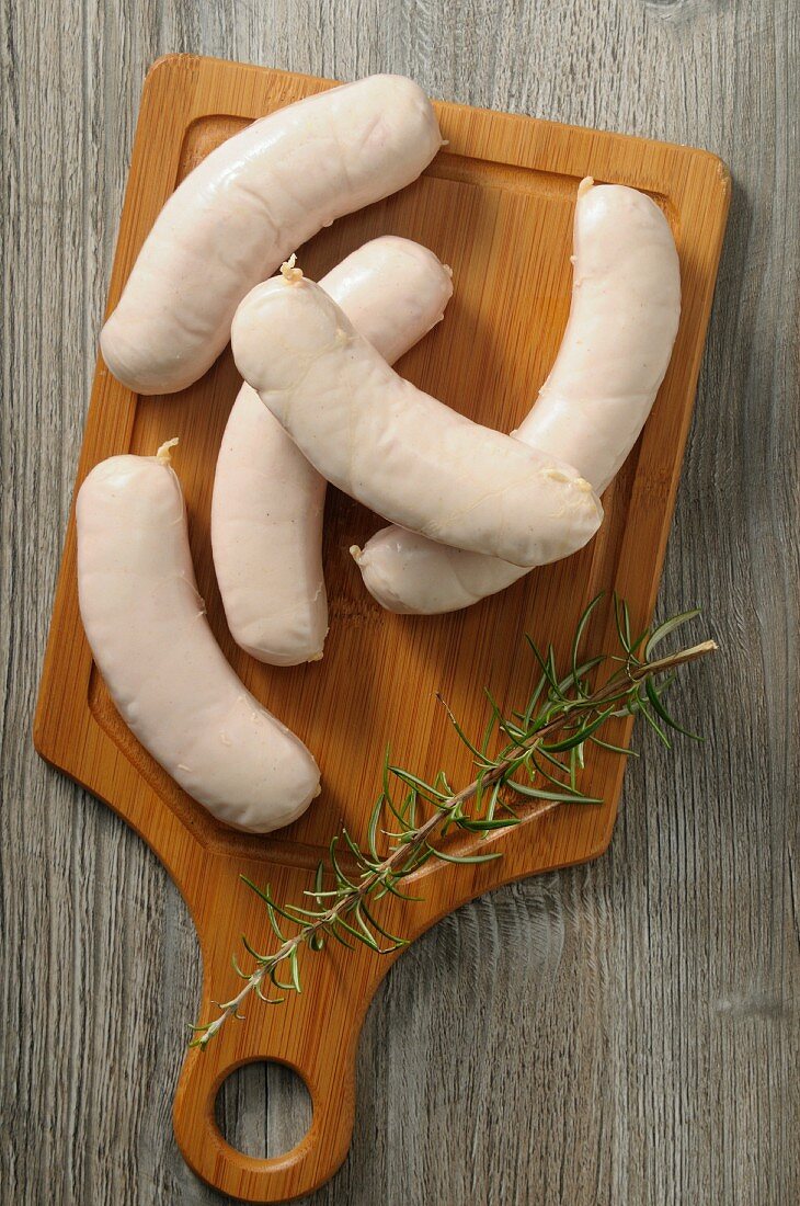 Boudin Blanc (French white sausage) on a wooden board
