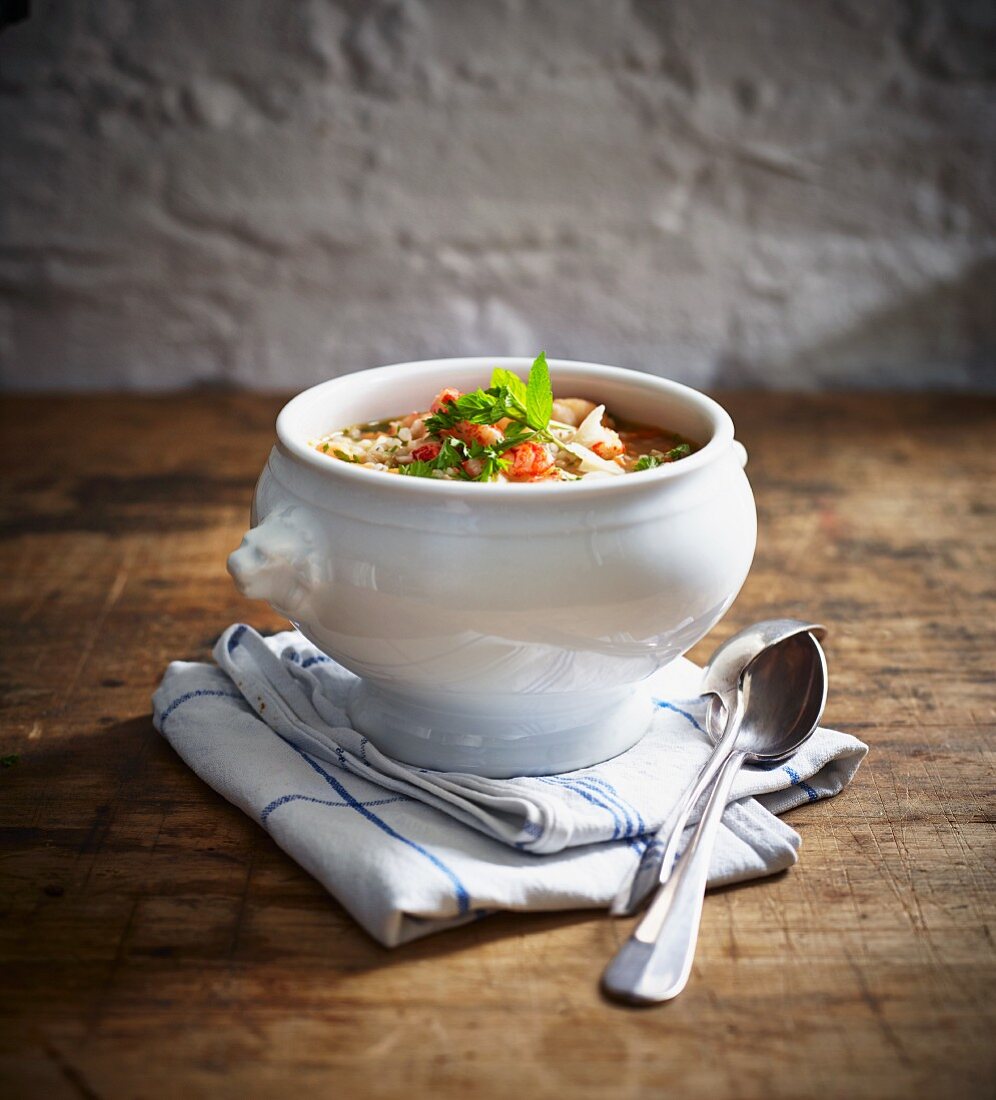 Barley soup with crayfish in a soup bowl