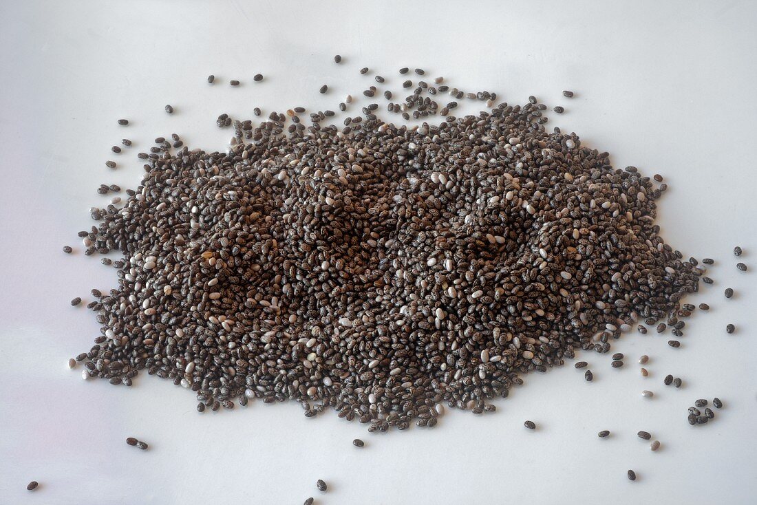 Chia seeds on a white surface