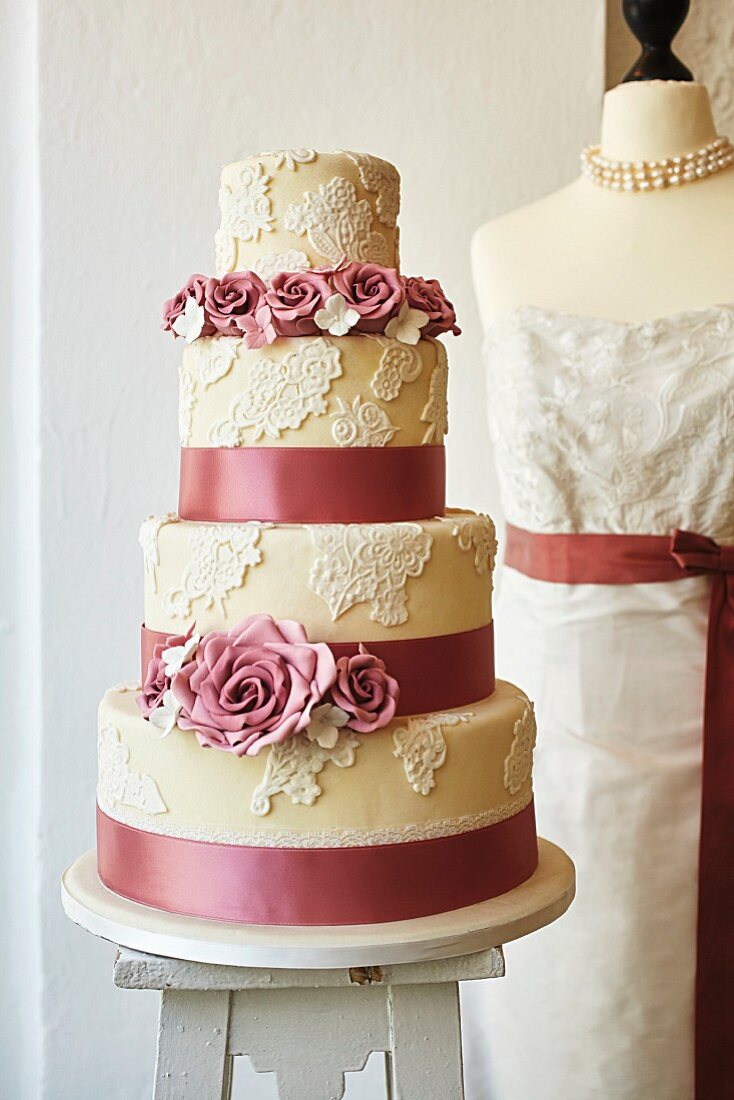 A wedding cake decorated with roses