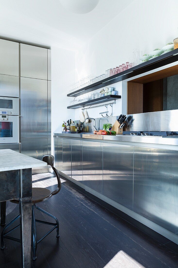 Kitchen with industrial-style stainless steel fronts