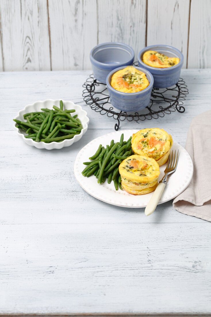 Mini frittatas with smoked salmon and broccoli served with green beans