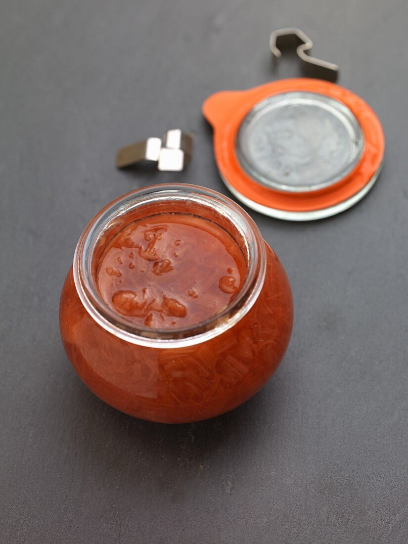 Rhubarb jam in an opened preserving jar