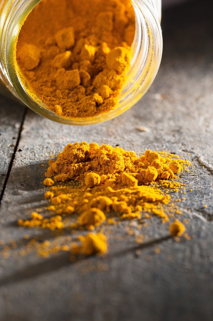 Turmeric powder on a wooden table