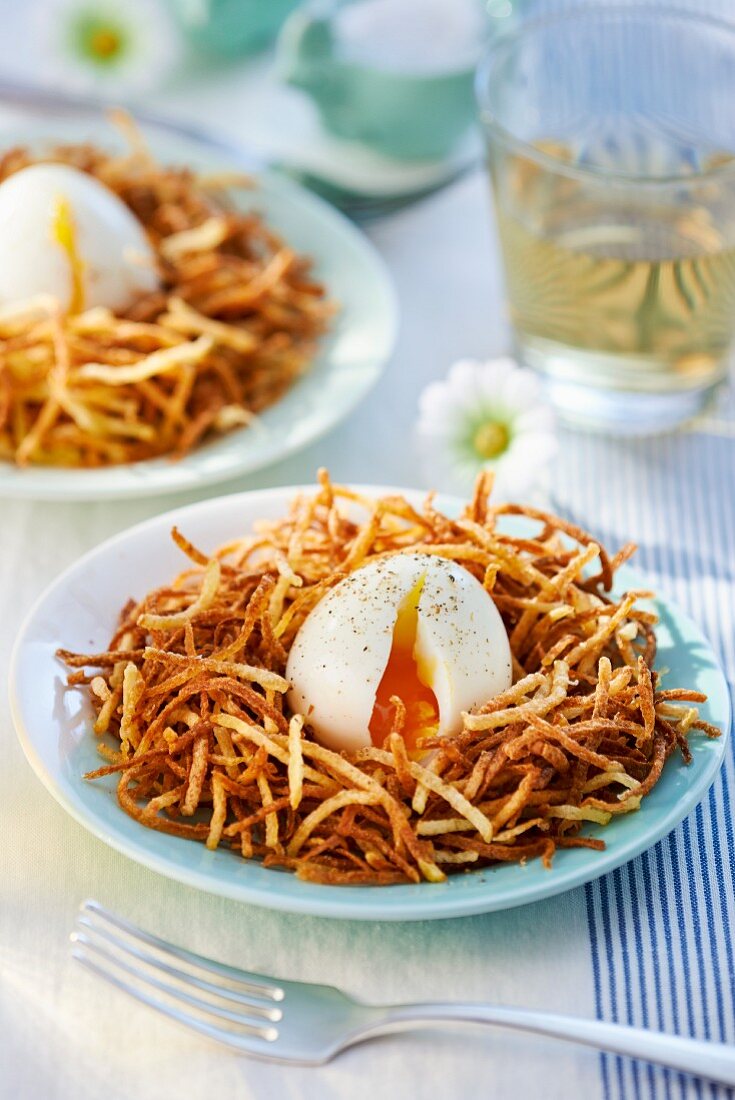 Poached egg on potato straw for Easter