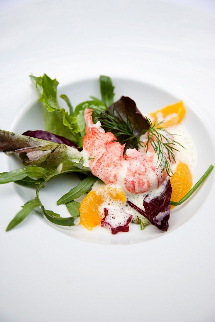 Lobster on a mixed leaf salad with orange butter