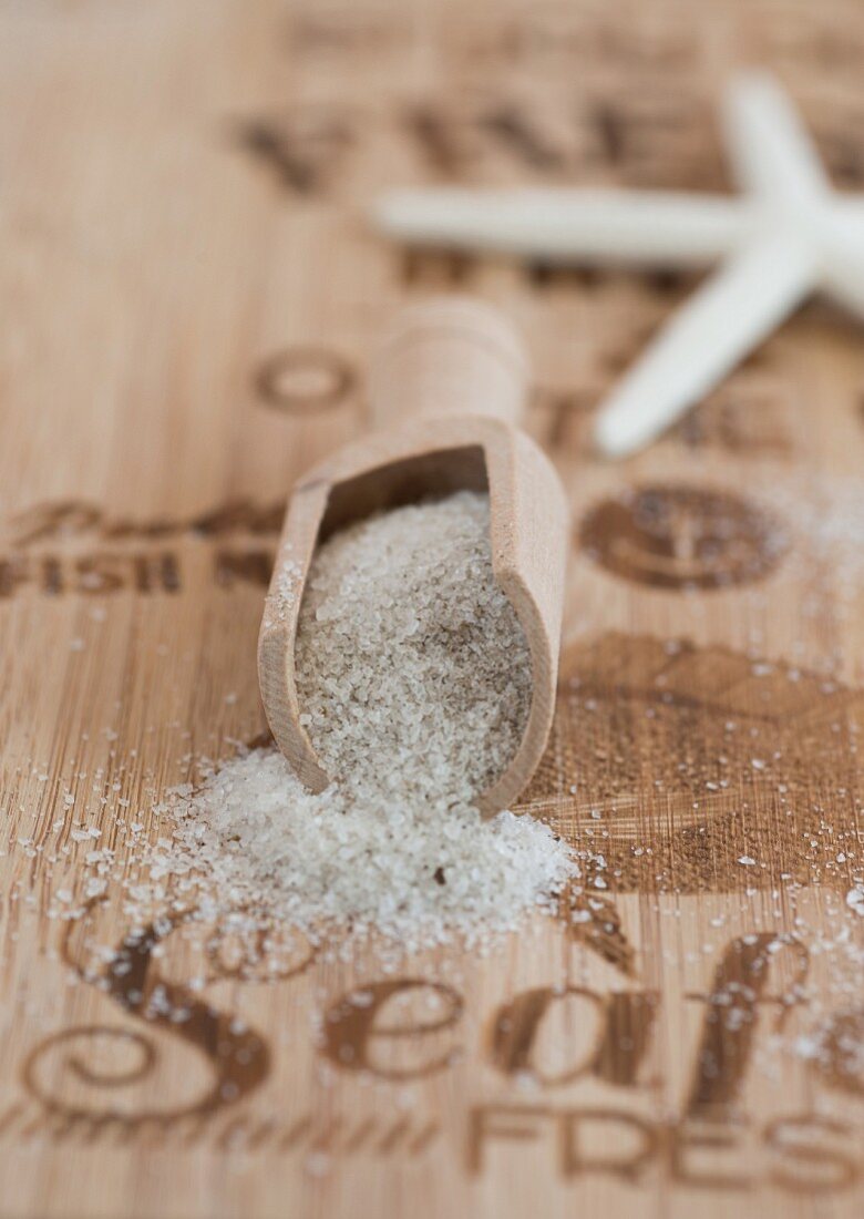 Sea salt with a wooden scoop