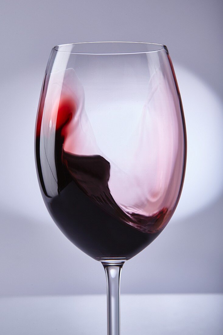 Red wine swilling in a glass