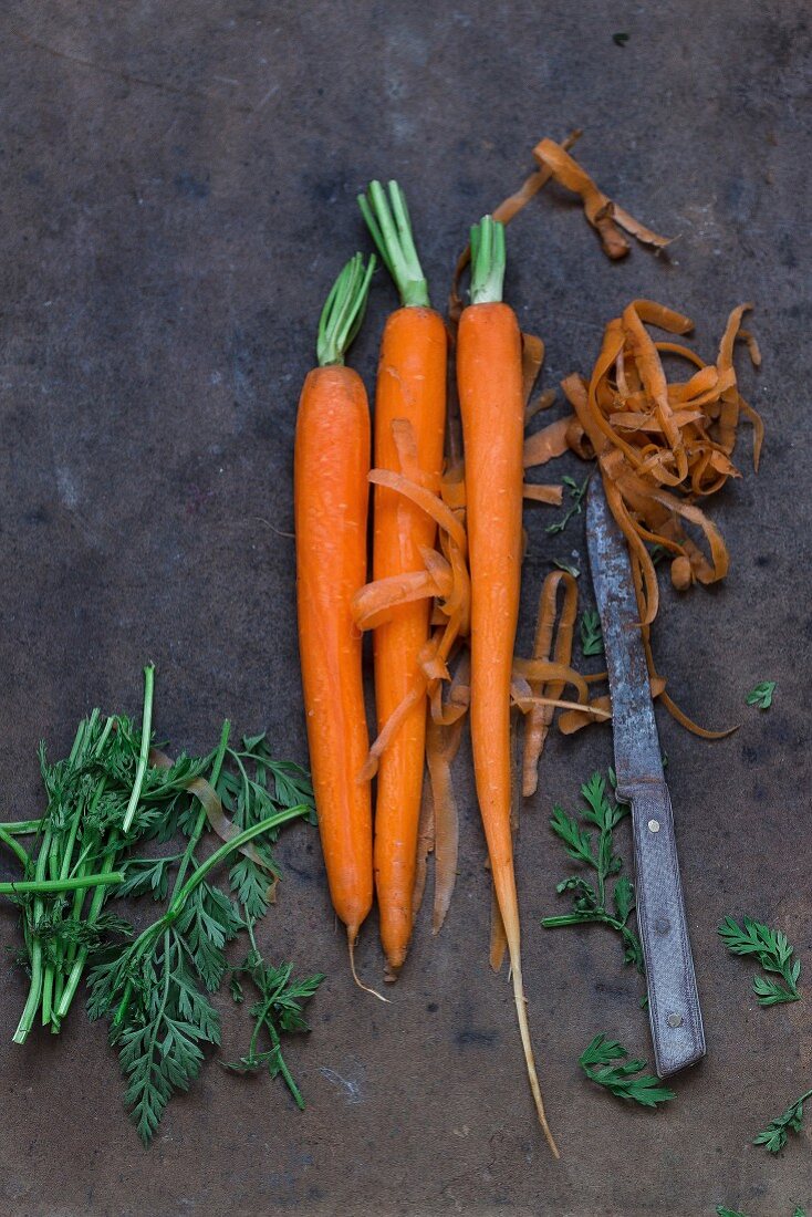 Peeled carrots with an old knife