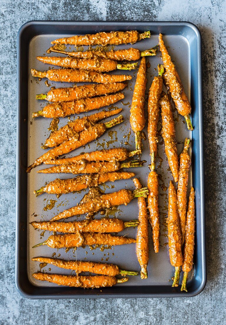 Tandoori carrots on a baking tray