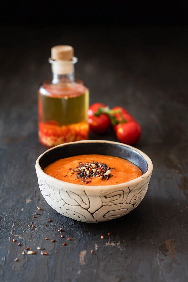 A smoothie bowl with tomato, chilli and mango