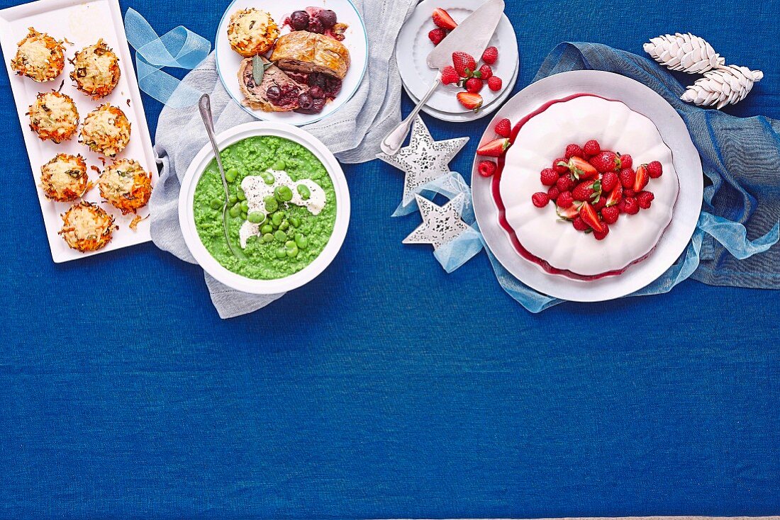Christmas buffet with mashed peas, potato cakes and coconut raspberry jelly
