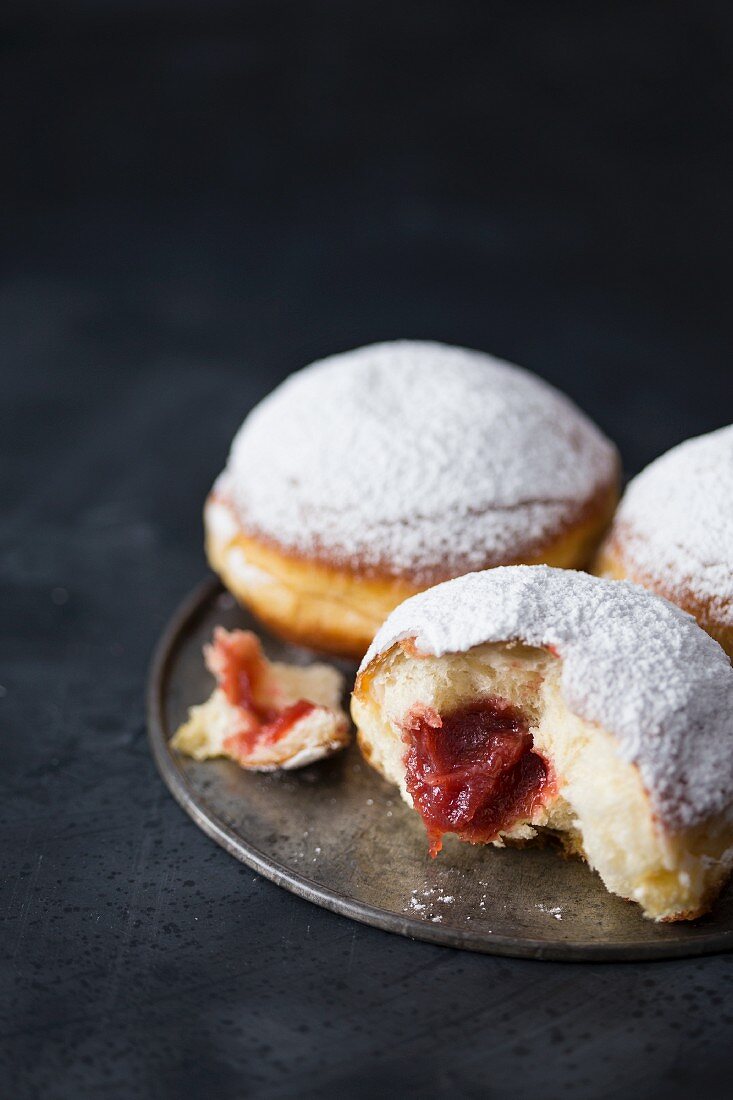 Traditional Polish donuts filled with marmalade and dusted with icing sugar