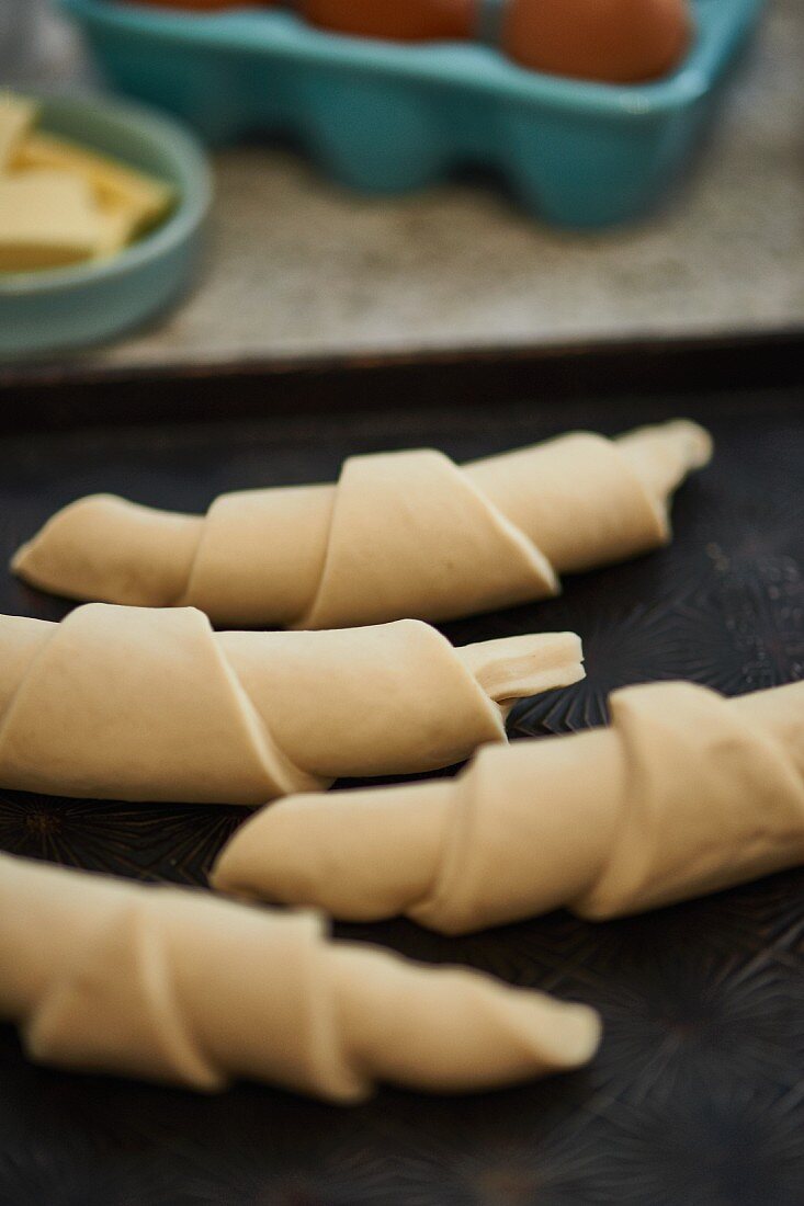 Unbaked croissants on a baking tray