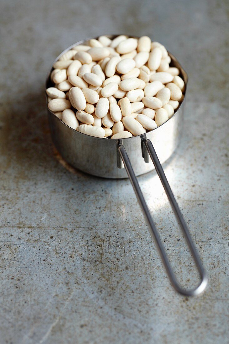 Dried white beans in a saucepan