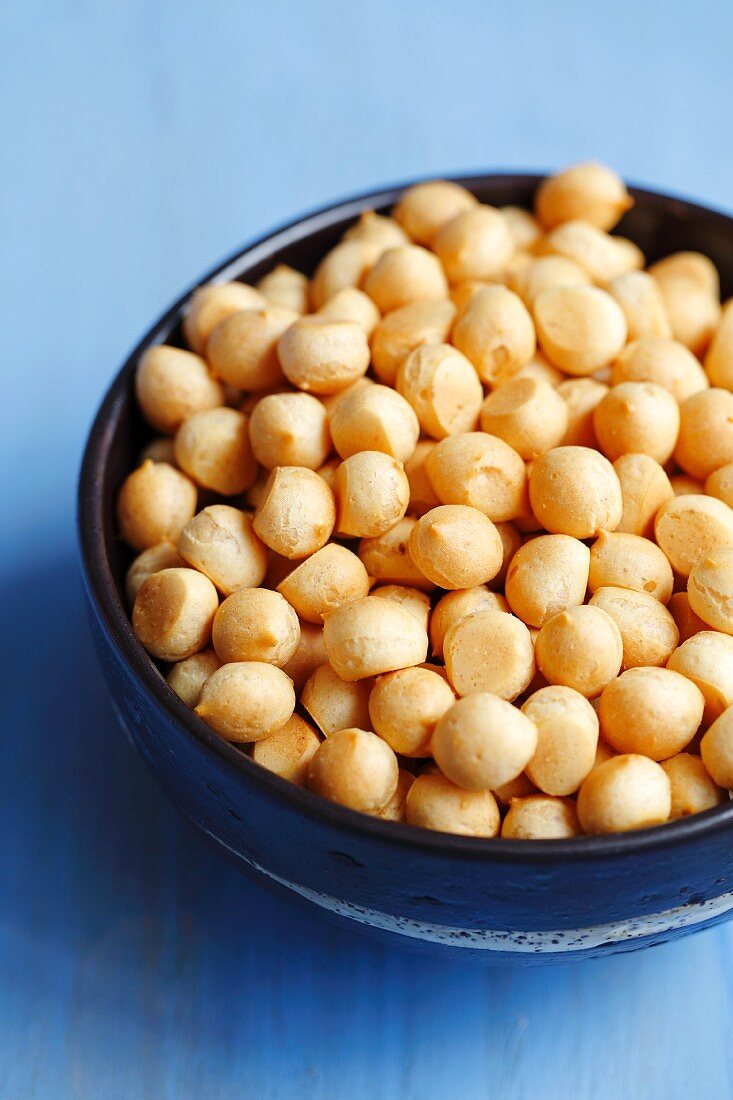 Mini choux pastry balls in a ceramic bowl